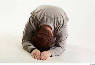 Luis Donovan Afgan Civil Praying kneeling praying whole body 0001.jpg